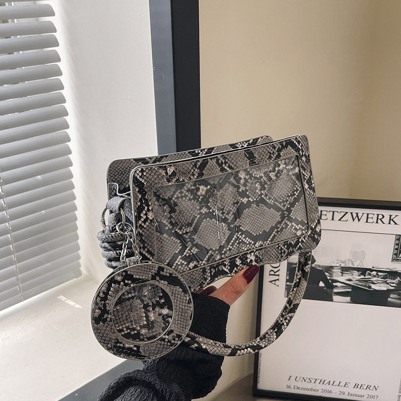 Umhängetasche für Damen ⎜ Stylische Crossbody-Tasche mit Schlangenmuster und transparentem Design-Element
