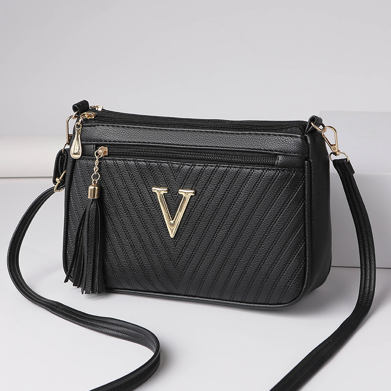 Umhängetasche für Damen ⎜ Kompakte Schultertasche mit Reißverschluss und Quaste für Alltag und Ausgehen