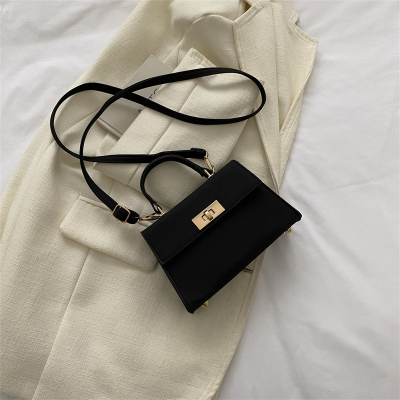 Umhängetasche für Damen ⎜ Klassische Mini-Handtasche mit Drehverschluss und Tragegriff für stilvolle Outfits
