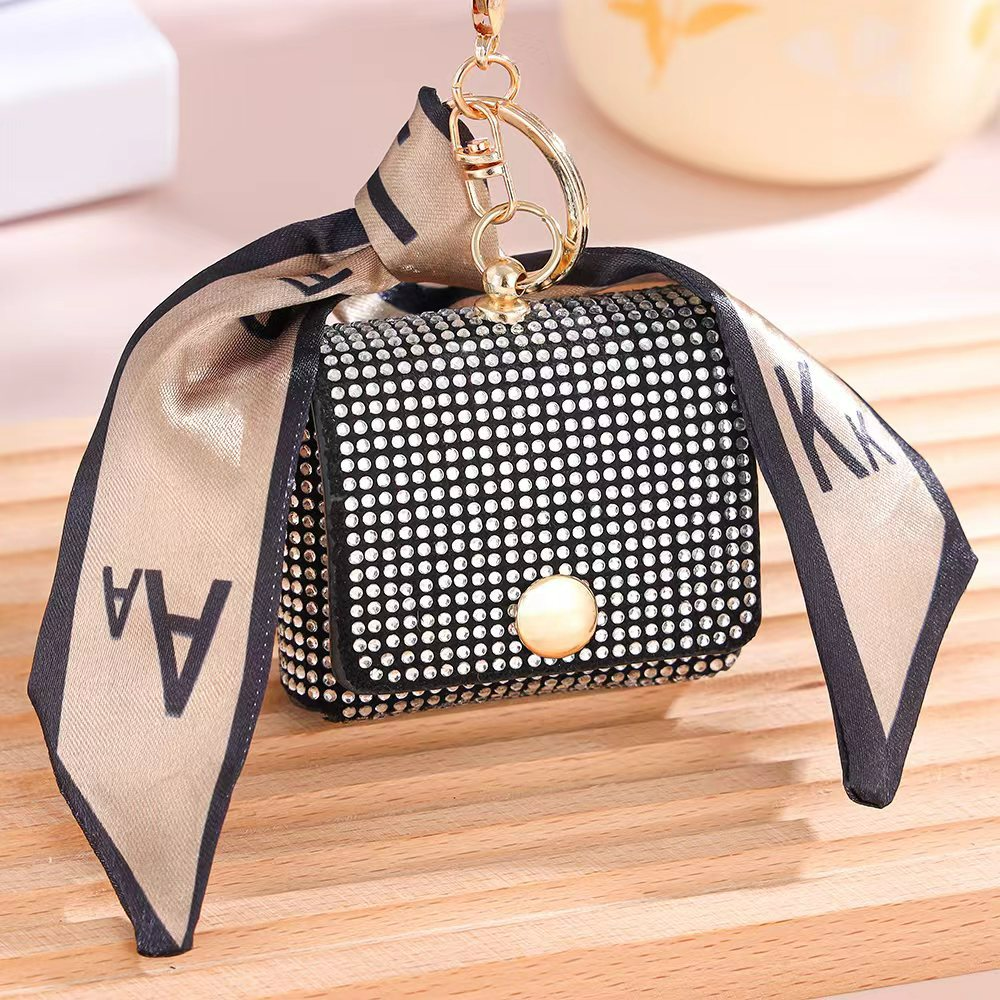 Damen Mini-Münzbörse mit Glitzersteinen ⎜ Stilvolle Tasche mit Schlüsselanhänger und dekorativem Band für unterwegs