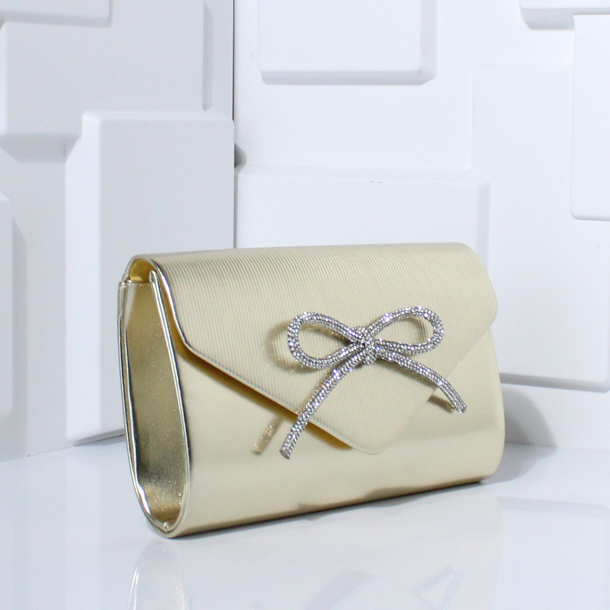 Abend-Clutch mit Schleifen-Design ⎜ Elegante Tasche mit Glitzerakzenten für festliche Anlässe