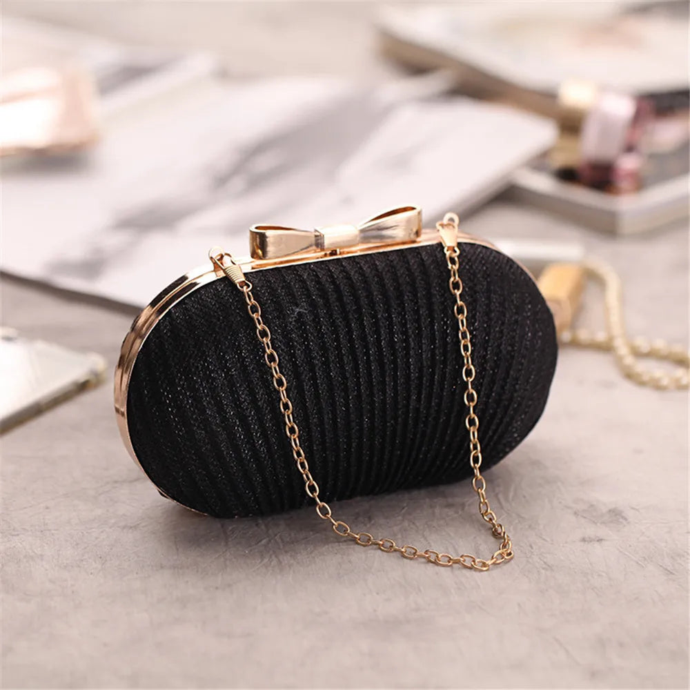 Clutch für Damen ⎜ Elegante Abendtasche in Faltenoptik mit Schleifendetail und Kettenträger für festliche Anlässe