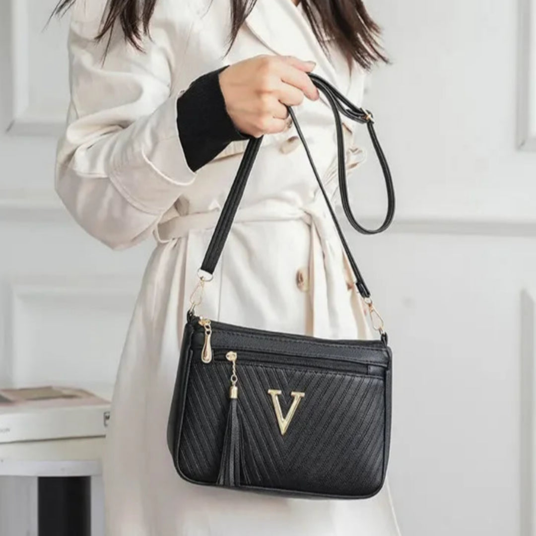 Umhängetasche für Damen ⎜ Kompakte Schultertasche mit Reißverschluss und Quaste für Alltag und Ausgehen