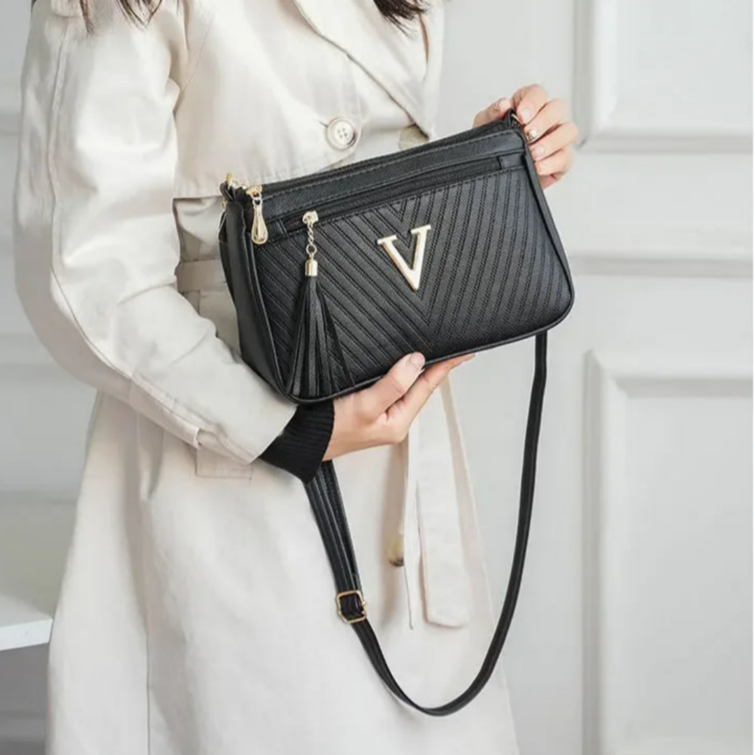 Umhängetasche für Damen ⎜ Kompakte Schultertasche mit Reißverschluss und Quaste für Alltag und Ausgehen