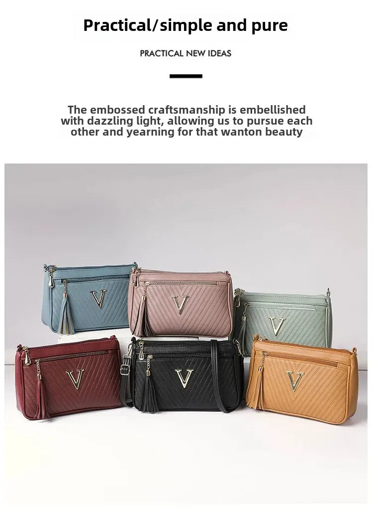Umhängetasche für Damen ⎜ Kompakte Schultertasche mit Reißverschluss und Quaste für Alltag und Ausgehen