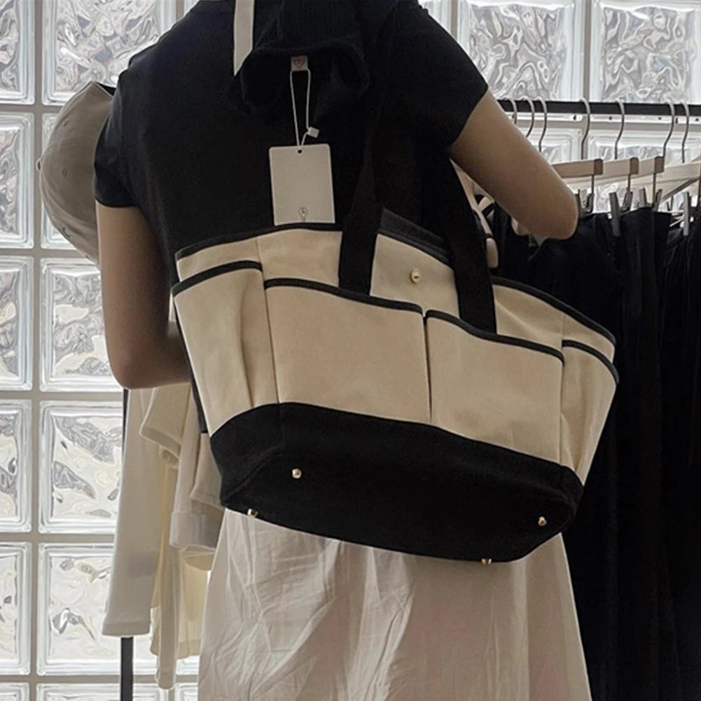 Wickeltasche für Eltern ⎜ Geräumige Tragetasche aus Canvas mit mehreren Fächern und praktischem Flaschenhalter
