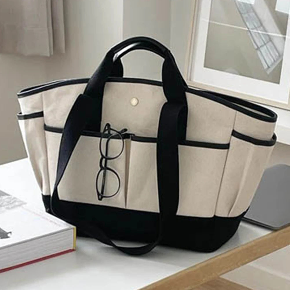 Wickeltasche für Eltern ⎜ Geräumige Tragetasche aus Canvas mit mehreren Fächern und praktischem Flaschenhalter