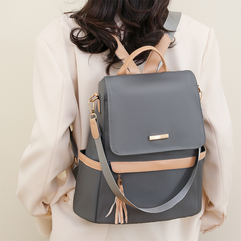 Damen Rucksack mit Quaste ⎜ Stylischer Tagesrucksack in Retro-Optik mit Fronttasche für Alltag und Freizeit