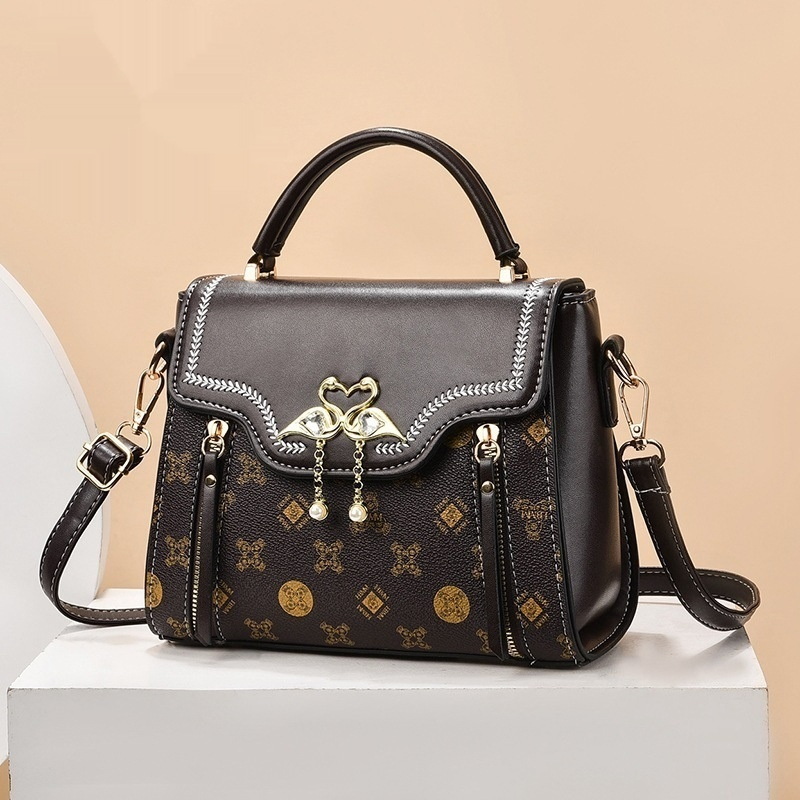 Handtasche für Damen ⎜ Modische Schultertasche mit Printmuster und dekorativem Verschluss für stilvolle Outfits