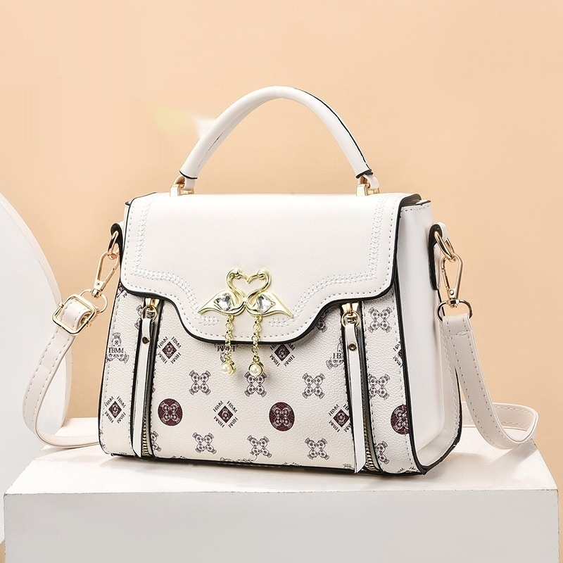 Handtasche für Damen ⎜ Modische Schultertasche mit Printmuster und dekorativem Verschluss für stilvolle Outfits