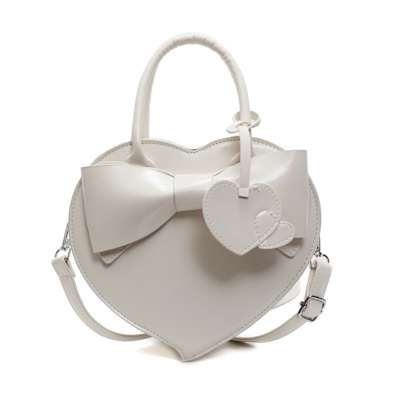 Herzförmige Umhängetasche für Damen ⎜ Verspielte Handtasche mit Schleife für Alltag und besondere Anlässe