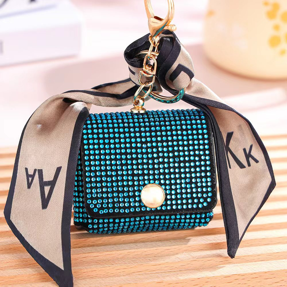 Damen Mini-Münzbörse mit Glitzersteinen ⎜ Stilvolle Tasche mit Schlüsselanhänger und dekorativem Band für unterwegs