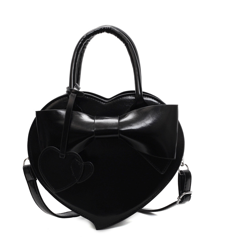 Herzförmige Umhängetasche für Damen ⎜ Verspielte Handtasche mit Schleife für Alltag und besondere Anlässe