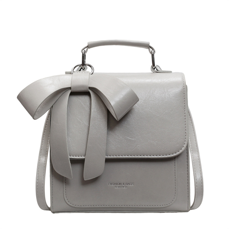 Moderne Umhängetasche für Damen ⎜ Elegante Tasche mit Schleifen-Design und praktischem Tragegriff