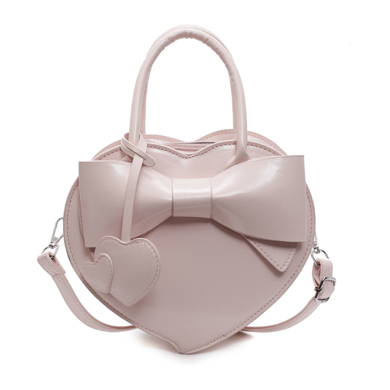 Herzförmige Umhängetasche für Damen ⎜ Verspielte Handtasche mit Schleife für Alltag und besondere Anlässe