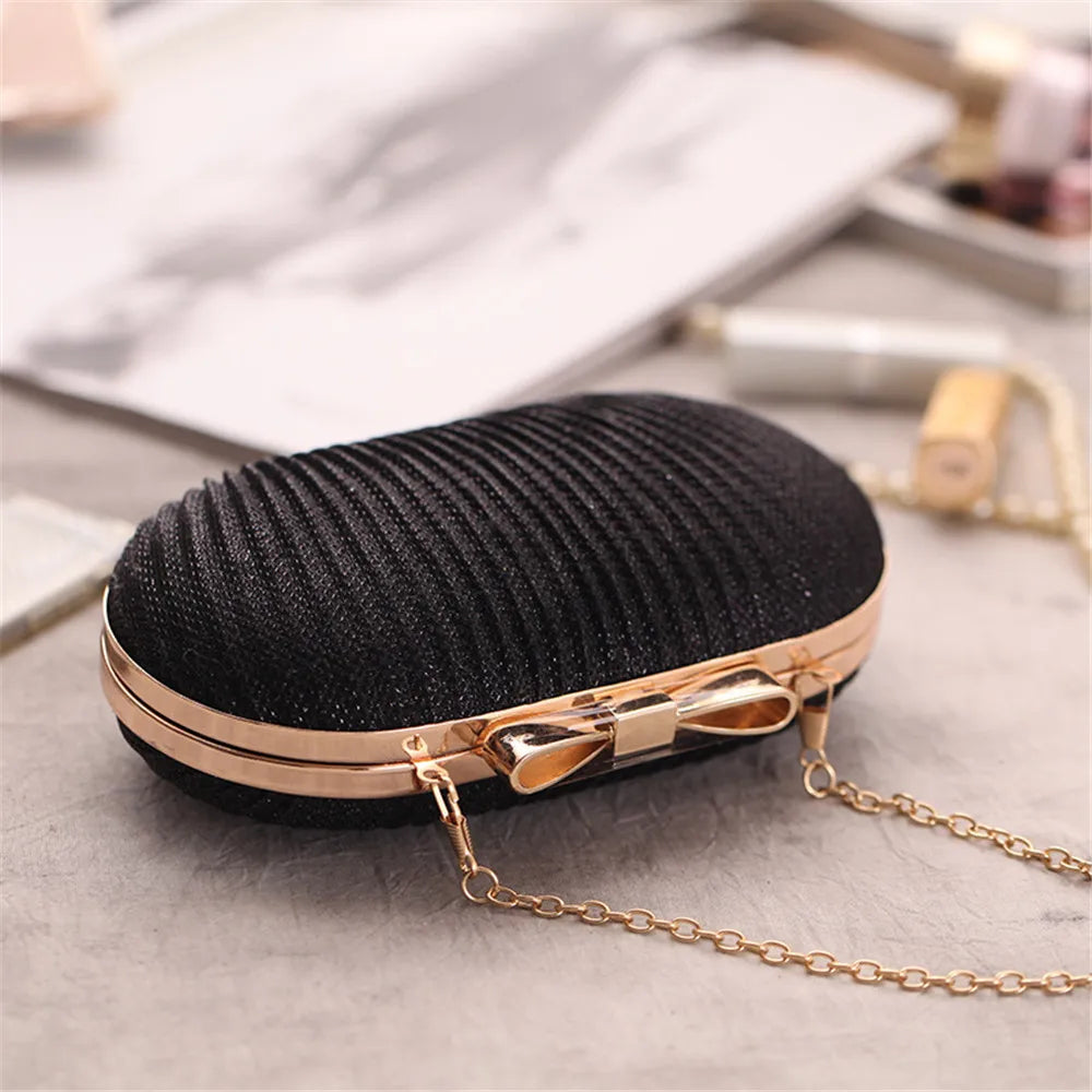 Clutch für Damen ⎜ Elegante Abendtasche in Faltenoptik mit Schleifendetail und Kettenträger für festliche Anlässe