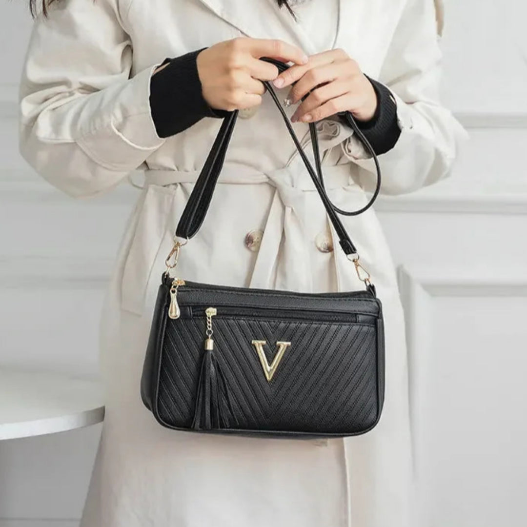 Umhängetasche für Damen ⎜ Kompakte Schultertasche mit Reißverschluss und Quaste für Alltag und Ausgehen